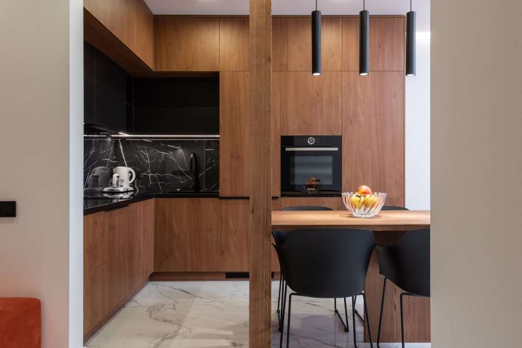 Wooden furniture and table in a contemporary kitchen with dining zone