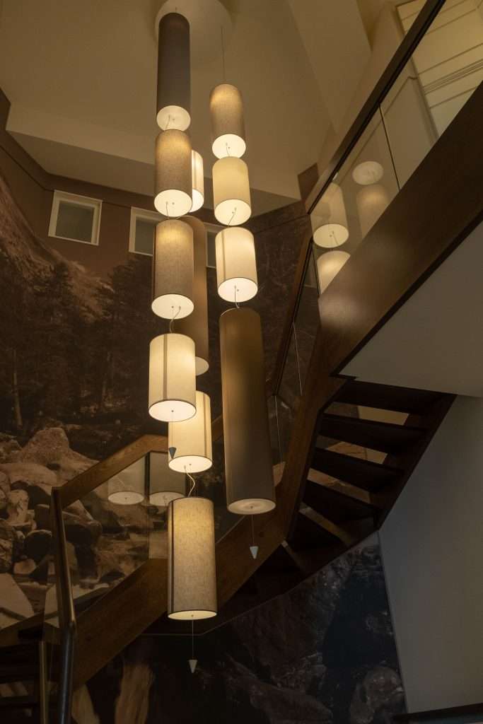 Pendant Lamps Hanging from a Ceiling Near a Wooden Stairs